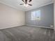 Bedroom featuring carpeted floors, a ceiling fan, and a window at 3764 Pinehurst St, Deltona, FL 32738