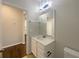 Bathroom featuring a single sink vanity with granite countertop and a mirror at 3882 Crawley Down Loop, Sanford, FL 32773