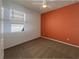 Bright bedroom featuring carpet and a window allowing natural light, and an accent wall at 3882 Crawley Down Loop, Sanford, FL 32773