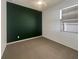 Cozy bedroom featuring neutral-toned walls and carpeting with a bright window at 3882 Crawley Down Loop, Sanford, FL 32773