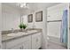 Well-lit bathroom featuring double sinks and shower/tub combo at 417 Ironside Trail Dr, Groveland, FL 34736