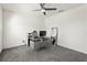 Minimalist office featuring neutral carpet and a modern desk with computer setup at 417 Ironside Trail Dr, Groveland, FL 34736