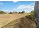 View of the property's backyard, bordering a golf course providing a scenic backdrop at 4724 Sable Ridge Ct, Leesburg, FL 34748