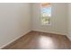 Bright room featuring hardwood floors and a window offering natural light and views at 4724 Sable Ridge Ct, Leesburg, FL 34748