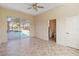 Bedroom with a view of the screened-in pool area and access to an en-suite bathroom at 4724 Sable Ridge Ct, Leesburg, FL 34748