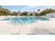 A large, outdoor community pool features a zero entry point, stainless steel railings, and lounge chairs at 4724 Sable Ridge Ct, Leesburg, FL 34748