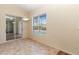 Dining area with tile flooring and view of the backyard pool through a large window at 4724 Sable Ridge Ct, Leesburg, FL 34748