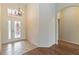 Inviting foyer with decorative front door, chandelier, and hardwood flooring at 4724 Sable Ridge Ct, Leesburg, FL 34748