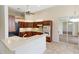 Bright kitchen with wood cabinetry, modern appliances, and ample counter space for cooking at 4724 Sable Ridge Ct, Leesburg, FL 34748