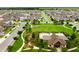 Aerial view of a Primary-planned community showcasing a pool, clubhouse, and well-maintained landscaping at 4796 Riverwalk Dr, St Cloud, FL 34771