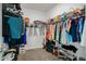 Walk-in closet with extensive shelving and storage solutions at 4796 Riverwalk Dr, St Cloud, FL 34771