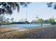 Spacious outdoor basketball court with lush trees nearby to enjoy a friendly game at 4852 Blue Major Dr, Windermere, FL 34786