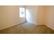 A bright bedroom with neutral carpet, closet, and a window providing natural light at 4852 Blue Major Dr, Windermere, FL 34786