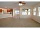 Spacious living room with view of the kitchen and dining area and neutral carpet at 4852 Blue Major Dr, Windermere, FL 34786