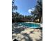 Community pool and patio area with lounge chairs for relaxation at 5271 Images Cir # 303, Kissimmee, FL 34746