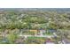 Sprawling community aerial view showcasing tree-lined street, manicured lawns, and neighborhood amenities at 5444 Lighthouse Rd, Orlando, FL 32808