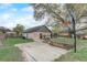 Large backyard with a sports court and a cozy fire pit area at 5444 Lighthouse Rd, Orlando, FL 32808