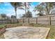 Private basketball court in a fenced backyard, perfect for sports and recreation at 5444 Lighthouse Rd, Orlando, FL 32808