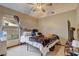 Comfortable bedroom featuring a cozy bed, soft bedding and natural light at 5444 Lighthouse Rd, Orlando, FL 32808