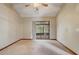 Bright bedroom with neutral paint, ceiling fan, and sliding glass door to a screened patio at 5444 Lighthouse Rd, Orlando, FL 32808