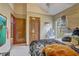 Cozy bedroom featuring a comfortable bed, natural light, and closet space at 5444 Lighthouse Rd, Orlando, FL 32808