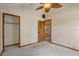 Carpeted bedroom featuring doorways to closet and another room at 5444 Lighthouse Rd, Orlando, FL 32808