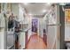 Galley kitchen with sleek countertops, white cabinetry, stainless appliances, offers ample counter space at 5444 Lighthouse Rd, Orlando, FL 32808
