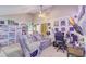 Eclectic living room featuring a vaulted ceiling, unique décor and comfortable seating at 5444 Lighthouse Rd, Orlando, FL 32808