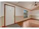 Living room features sleek hardwood floors, large windows, and neutral paint colors at 5444 Lighthouse Rd, Orlando, FL 32808