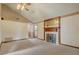 Spacious living room with a fireplace and neutral carpeting at 5444 Lighthouse Rd, Orlando, FL 32808