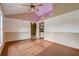 A spacious living room with hardwood floors, neutral walls and vaulted ceilings is well lit and inviting at 5444 Lighthouse Rd, Orlando, FL 32808