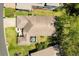 An aerial top-down view of the home showcases the roofline, landscaping, and outdoor living space at 5676 Gulf Stream St, Tavares, FL 32778