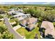 Aerial view of a well-kept neighborhood featuring mature trees, landscaping, and a view of the countryside at 5676 Gulf Stream St, Tavares, FL 32778