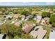 Aerial view of a quiet neighborhood with well-maintained lawns, landscaping, and waterfront access at 5676 Gulf Stream St, Tavares, FL 32778