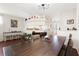 Elegant dining room with hardwood floors, modern lighting, and seamless flow to the living areas at 5676 Gulf Stream St, Tavares, FL 32778