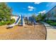 Well-maintained community playground features a modern slide and climbing structure for outdoor fun at 5814 Bimini Twist Loop, Orlando, FL 32819