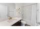 Clean bathroom featuring a shower-tub combo, a white sink, and gold accents at 5841 Bullock Pl, St Cloud, FL 34771