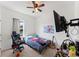 Bedroom featuring a ceiling fan, toys, and decor at 5841 Bullock Pl, St Cloud, FL 34771