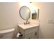 Bathroom featuring a modern vanity, mirror, and stylish fixtures at 609 Gallery Dr # 2, Winter Park, FL 32792