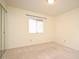 Neutral bedroom featuring mirrored closet doors and a window at 609 Gallery Dr # 2, Winter Park, FL 32792