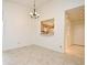 Bright dining area featuring tile flooring and a convenient kitchen pass-through at 609 Gallery Dr # 2, Winter Park, FL 32792