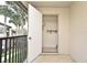 Balcony entrance to utility closet with a door and a shelf, offering storage on the balcony at 609 Gallery Dr # 2, Winter Park, FL 32792