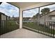 Relaxing balcony view overlooking lush landscaping, swimming pool and serene surroundings with tile flooring at 609 Gallery Dr # 2, Winter Park, FL 32792