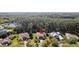 Wide aerial shot showcasing the home's location amongst mature trees and in a desirable neighborhood at 6424 Cartmel Ln, Windermere, FL 34786