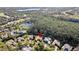 Expansive aerial view highlighting the home's proximity to lush greenery and nearby community amenities at 6424 Cartmel Ln, Windermere, FL 34786