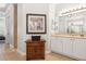 This bathroom features and sinks, vanity and cabinet storage with views to the bedroom at 6424 Cartmel Ln, Windermere, FL 34786