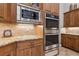 Kitchen area with stainless steel appliances and custom cabinetry at 6424 Cartmel Ln, Windermere, FL 34786