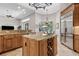 Well-equipped kitchen with a central island and stainless steel refrigerator at 6424 Cartmel Ln, Windermere, FL 34786