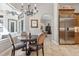 Bright eat-in kitchen with stainless steel refrigerator and chandelier lighting at 6424 Cartmel Ln, Windermere, FL 34786