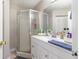 Well-lit bathroom featuring a shower and ample counter space at 729 Secret Harbor Ln # 105, Lake Mary, FL 32746